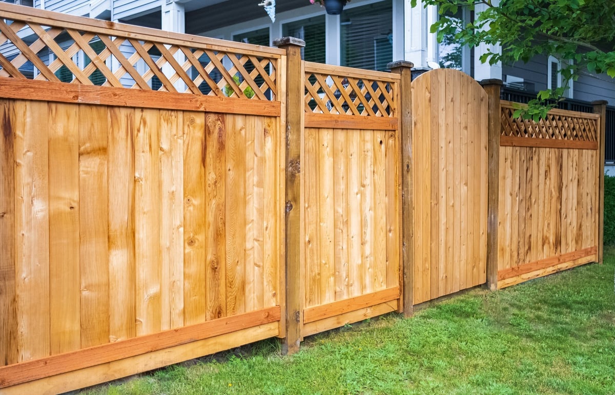 Professionally built American wood privacy fence around a residential home
